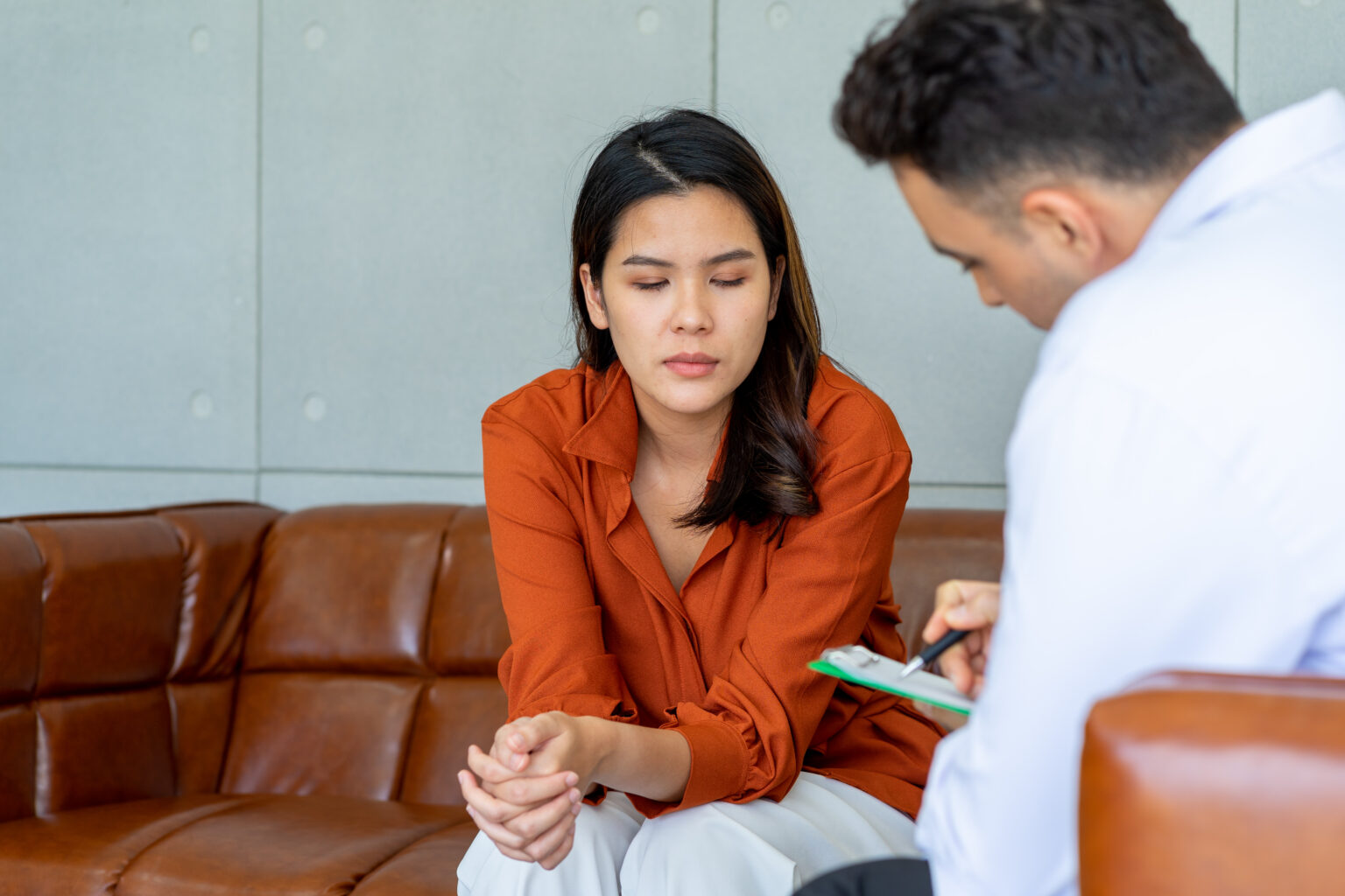 caucasian male doctor consulting the patient female in the clinic