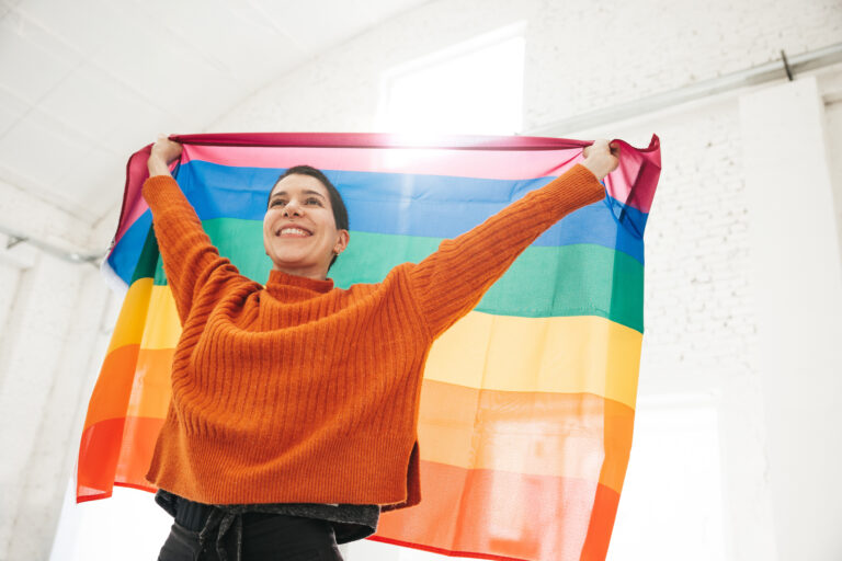 Young woman with short hair stands for LGBTQIA rights